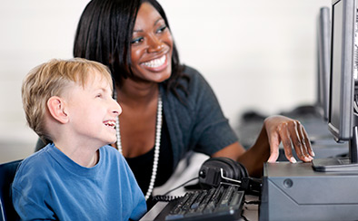 Smiling child reading a book